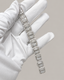 Sterling silver tennis bracelet with baguette-cut stones, featuring a hip-hop style design by Kynora Jewels.