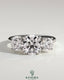 Kynora CJ 2ct round claw trilogy engagement ring with round side stones and trellis gallery setting, sparkling and elegant.