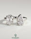 Kynora CJ Toi et Moi engagement ring with 1.23ct oval and 1.15ct pear-shaped diamonds on an open band.