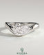Kynora CJ 2ct pear-shaped east-west solitaire engagement ring with wave band featuring a prominent diamond in a detailed setting.