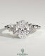 Kynora CJ 2ct oval claw solitaire engagement ring with clustered round shoulder stones, three-stone design, elegant and sparkling.