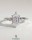 Kynora CJ 2ct elongated hexagon claw trilogy engagement ring with kite side stones, featuring three-stone design and intricate detailing.