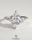 Kynora CJ three-stone engagement ring featuring 2ct marquise center stone, pear side stones, and cathedral setting in gold.