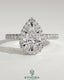 Kynora CJ 2ct pear-shaped diamond solitaire halo engagement ring with pave band and low setting, elegant and sparkling jewelry piece.