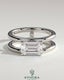 Kynora CJ 2ct emerald east-west claw solitaire engagement ring with a double band and spaced design.