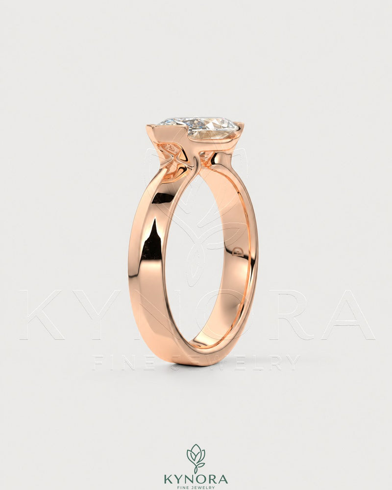 East-West Marquise Moissanite solitaire ring in sterling silver by Kynora CJ, showcasing a sparkling marquise-shaped gemstone.