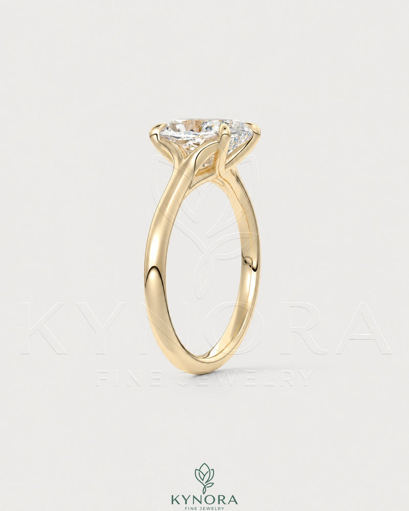 Cushion cut moissanite solitaire engagement ring in 925 sterling silver featuring a prominent central gemstone and sleek band.
