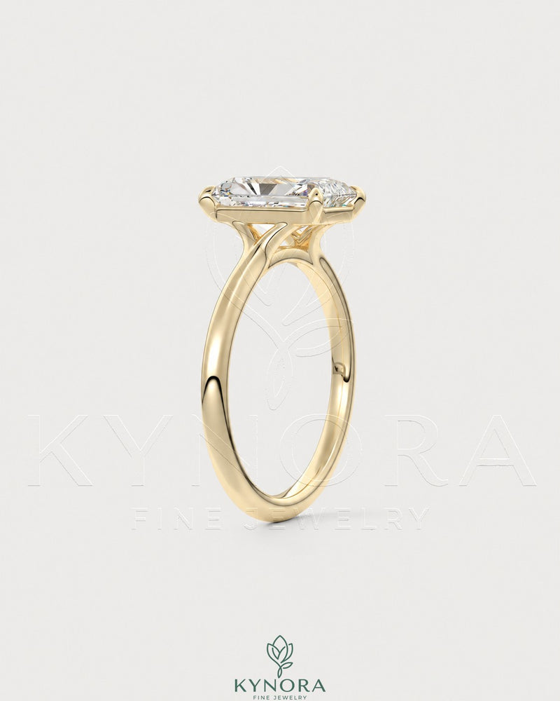 Radiant cut moissanite solitaire engagement ring in 925 silver with a sleek band and sparkling center stone.