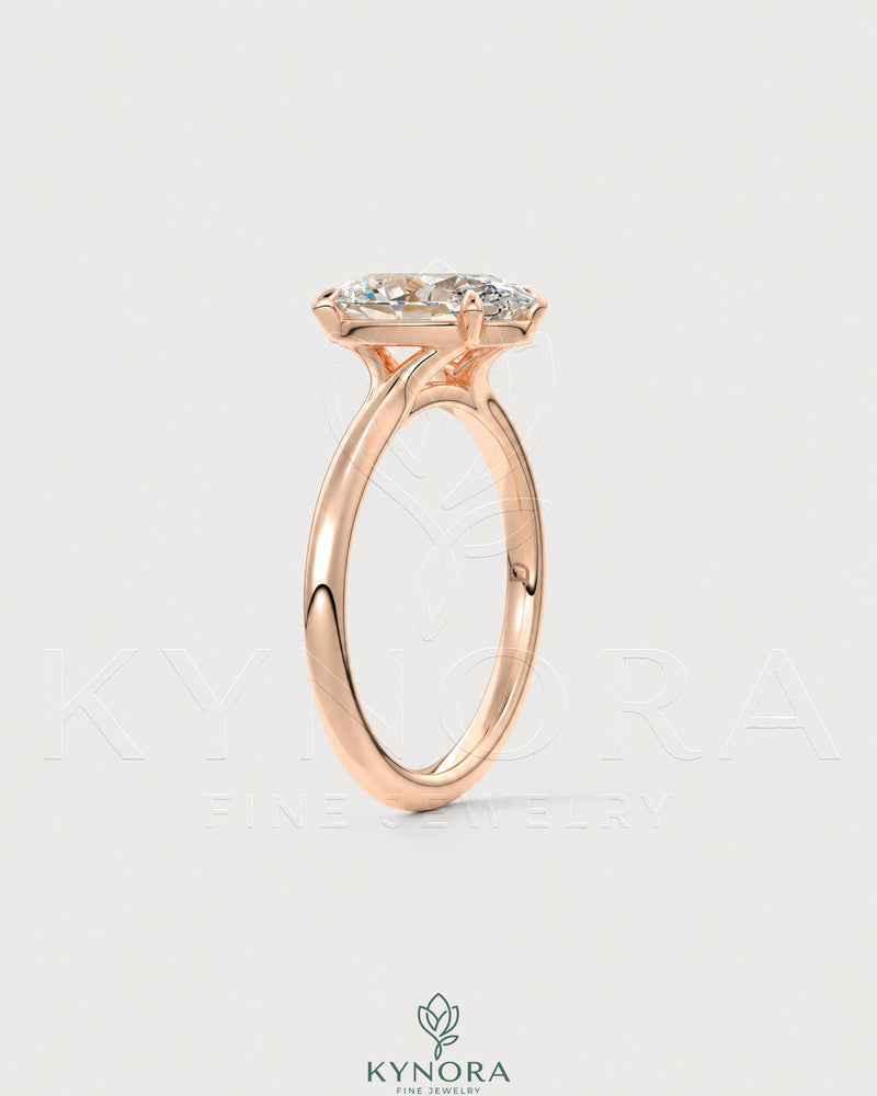 Oval cut moissanite solitaire engagement ring in 925 sterling silver with a sleek band and sparkling gemstone.