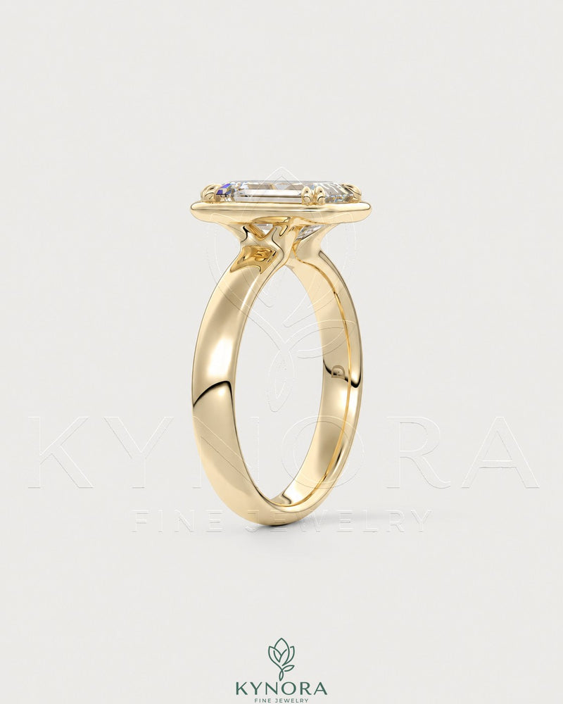 Emerald cut moissanite bezel engagement ring in 925 silver featuring a sleek design and sparkling central gemstone.