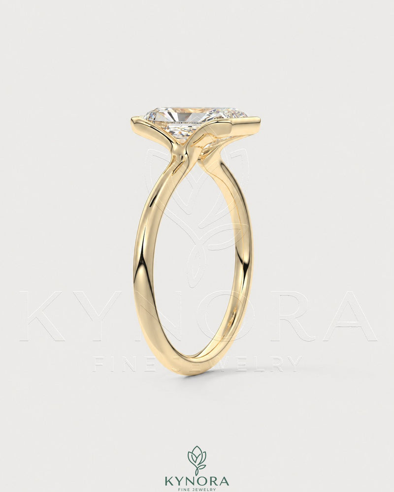 Radiant cut moissanite half-bezel engagement ring in 925 silver with intricate band detail, by Kynora CJ.