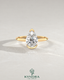 Pear cut moissanite half-bezel engagement ring in 925 silver with a sleek design on an ivory backdrop.