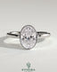 Kynora CJ 2ct oval bezel solitaire engagement ring with petal gallery design, showcasing a sparkling center stone and intricate band details.