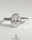 Kynora CJ 2ct oval bezel solitaire engagement ring with twisted gallery design, featuring a sparkling central stone and intricate band details.