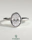 Kynora CJ statement 2-carat oval bezel solitaire engagement ring with open cathedral high setting, showcasing elegant jewelry design.