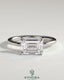 Kynora CJ 2ct emerald East-West claw solitaire engagement ring featuring a vibrant green emerald gemstone set horizontally.