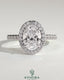 Kynora CJ 2ct oval claw solitaire engagement ring with halo, pave band, and cathedral high setting showcasing detailed craftsmanship.