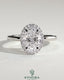 Kynora CJ 2ct oval claw solitaire engagement ring with halo of smaller diamonds, showcasing elegant design and sparkling center stone.