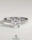 Kynora CJ 2ct cushion claw solitaire engagement ring with hidden halo and pavé band, showcasing elegant diamond design.