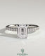 Kynora CJ 2ct emerald claw solitaire engagement ring with hidden halo and pave band, showcasing a sparkling emerald center stone.