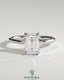 Kynora CJ 2ct emerald claw solitaire engagement ring with petal gallery and leaf accent detailing, crafted in elegant jewelry style.