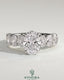 Kynora CJ 2ct oval claw solitaire engagement ring with half eternity oval band and hidden halo, featuring sparkling diamond accents.