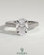 Kynora CJ 2ct oval claw solitaire engagement ring with hidden halo and triple pave band, showcasing sparkling diamond details.