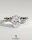 Kynora CJ 2ct oval claw solitaire engagement ring with hidden halo and twisted pave band, showcasing elegant diamond craftsmanship.
