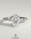 Kynora CJ 2ct oval claw solitaire engagement ring with marquise and round accent stones, featuring a sleek platinum band.