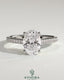 Kynora CJ 2ct oval claw solitaire engagement ring with pave band and cathedral low setting in shining gold.
