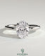 Kynora CJ 2ct oval claw solitaire engagement ring with wrap-around hidden halo design, showcasing elegant diamond setting.