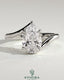 Kynora CJ 2ct pear-shaped diamond solitaire engagement ring with bypass band in sleek gold setting.