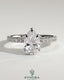 Kynora CJ 2ct pear-shaped solitaire engagement ring with wrap-around hidden halo and pave band, five-prong setting.