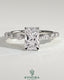 Kynora CJ 2ct radiant claw solitaire engagement ring with marquise and round accent stones, featuring a wrap-around hidden halo design.