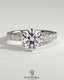 Kynora CJ 2ct round diamond claw solitaire engagement ring with half eternity band, showcasing sparkling center stone and elegant design.