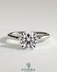 Kynora CJ 2ct round claw solitaire engagement ring with hidden halo, showcasing sparkling diamond centerpiece and elegant design.