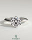 Kynora CJ 2ct round diamond claw solitaire engagement ring with a sleek knife edge band, showcasing elegant jewelry craftsmanship.