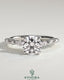 Kynora CJ 2ct round claw solitaire engagement ring with marquise and round accent stones, elegant and sparkling jewelry piece.