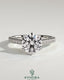 Kynora CJ 2ct round claw solitaire engagement ring with pave band and cathedral high setting, showcasing sparkling diamond details.