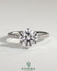 Kynora CJ 2ct round diamond claw solitaire engagement ring with pave band, showcasing sparkling diamond and elegant platinum setting.