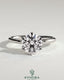 Kynora CJ 2ct round claw solitaire engagement ring with petal gallery design, featuring a sparkling central diamond and intricate band.