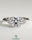Kynora CJ 2ct round claw solitaire engagement ring with round shoulder stones, showcasing elegant diamond setting and band details.