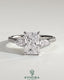 Kynora CJ 2ct radiant claw trilogy engagement ring with pear side stones and pave band, showcasing elegant diamond craftsmanship.