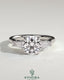 Kynora CJ three-stone engagement ring with 2ct round center diamond, tapered baguette side stones, cathedral setting.