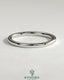 Plain gold wedding band by Kynora CJ, showcasing a simple, classic design for wedding or special occasions.