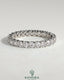 Kynora CJ full round eternity wedding band with scalloped setting, featuring intricate design and sparkling gemstones.
