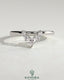 Kynora CJ Pear round accent stone wedding band with curved design, elegant gold wedding ring featuring sparkling gemstones.