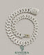 20mm VVS1 moissanite diamond silver Cuban link chain by Kynora Jewels, showcasing the bold, shiny hiphop jewelry design.