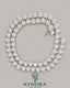 Sterling silver heart-shaped moissanite diamond halo tennis chain with 7mm VVS1 stones, crafted by Kynora Jewels.