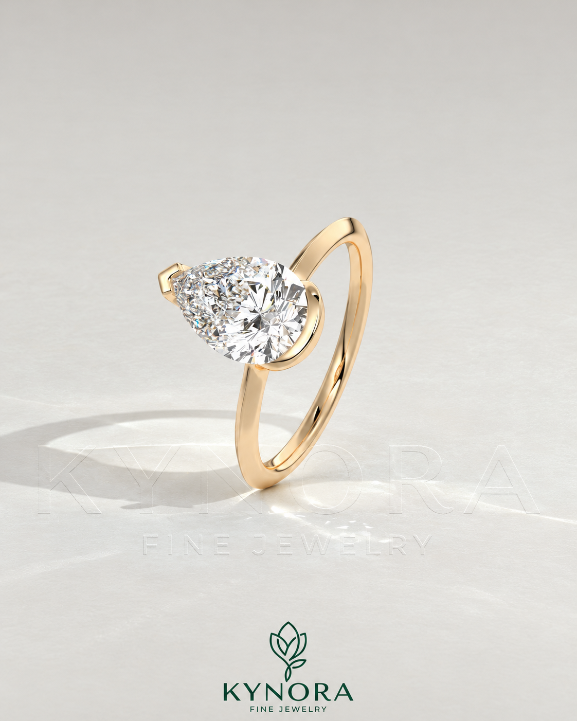 Pear cut moissanite half-bezel engagement ring in 925 silver with intricate detailing, showcased on an ivory background.